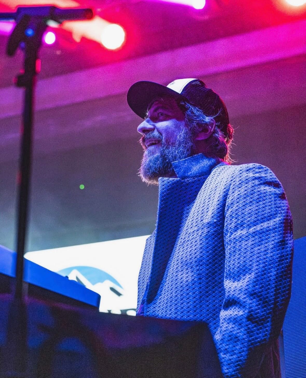 Kyle Moon standing at keyboards and singing